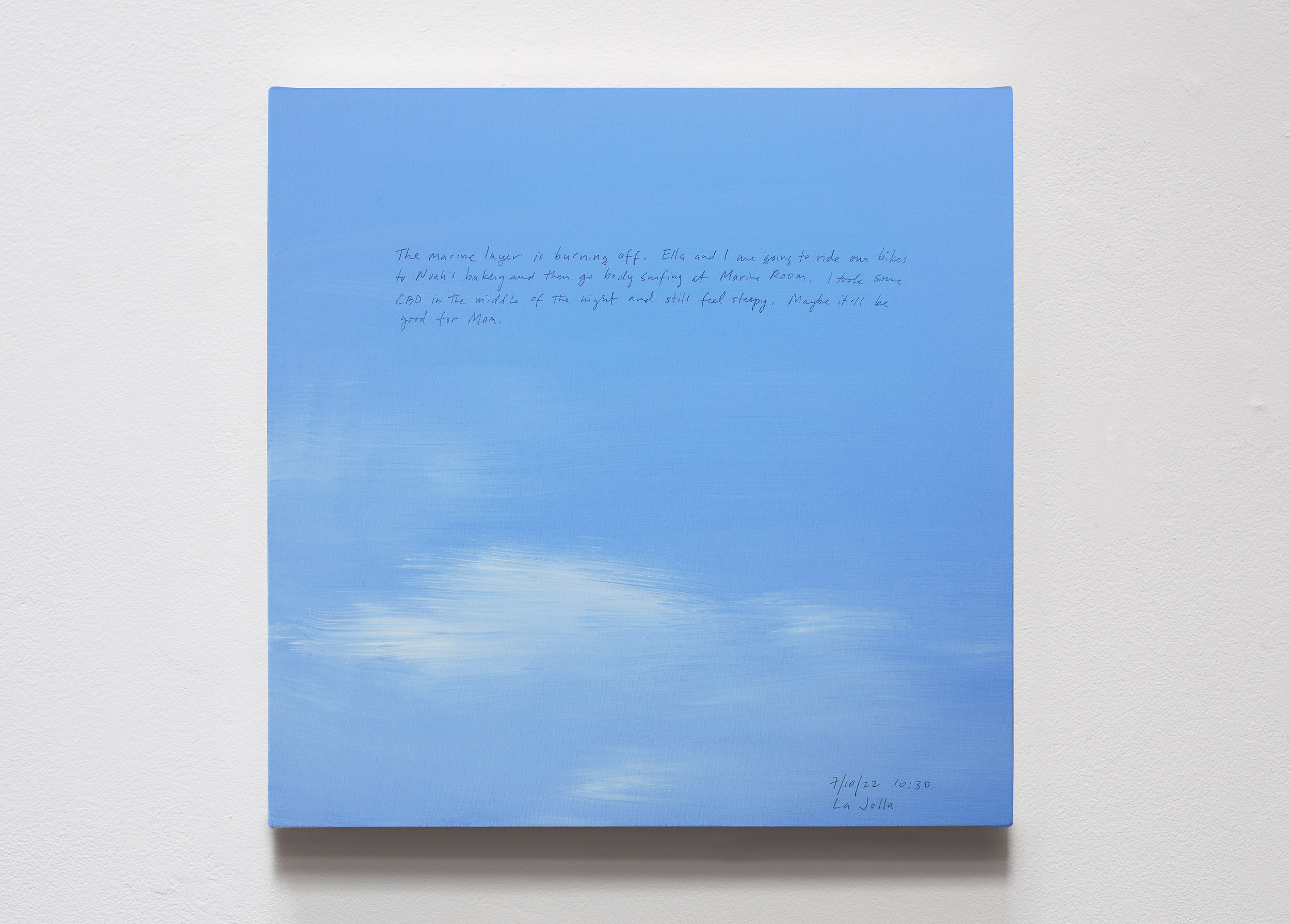 A 14 × 14 inch, acrylic painting of the sky. A journal entry is handwritten on the painting:

“The marine layer is burning off. Ella and I are going to ride our bikes to Noah’s bakery and then go body surfing at Marine Room. I took some CBD in the middle of the night and still feel sleepy. Maybe it’ll be good for Mom.

7/10/22 10:30
La Jolla”